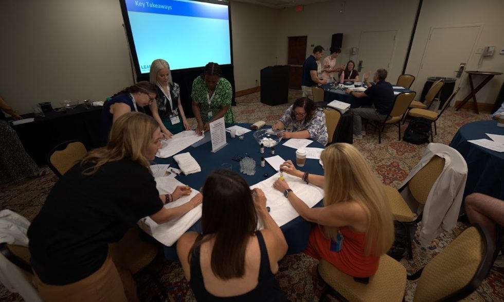 A hands-on workshop table during an intensive