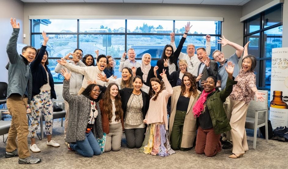 Fellows celebrating together at the close of an intensive